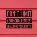 Inspirational motivational quote `Don`t limit your challenges. Challenge your limits.`