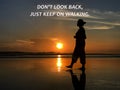 Inspirational motivational quote - Don`t look back, just keep on walking. With silhouette of a woman walking alone on the beach.