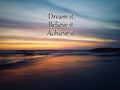 Inspirational motivational quote - Dream it. Believe it, Achieve it. With blurry background of colorful sunset sunrise sky.