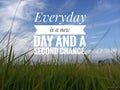 Inspirational motivational quote - Everyday is a new day and a second chance. With background of white clouds and bright blue sky Royalty Free Stock Photo