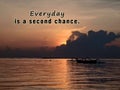 Inspirational motivational quote - Everyday is a second chance. With blurry image background of the sun peeking behind clouds. Royalty Free Stock Photo