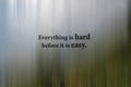 Inspirational motivational quote - Everything is hard before it is easy. Motivation words on gray and green abstract illustration