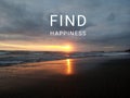 Inspirational motivational quote - Find Happiness. With blurry image of beach landscape, sunset light over horizon. Royalty Free Stock Photo