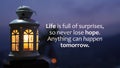 Inspirational motivational quote - Life is full of surprises. So never lose hope. Anything can happen tomorrow. With lantern. Royalty Free Stock Photo