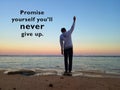 Inspirational motivational quote - Promise yourself you will never give up. With blurry background of young man standing beach Royalty Free Stock Photo
