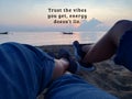 Inspirational motivational quote - Trust the vibes you get, energy does not lie. With blurry image background of two legs best