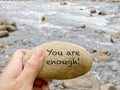 Inspirational motivational quote - You are enough. Text on rock background. Royalty Free Stock Photo