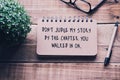 Inspirational quotes on a notepad - Don`t judge my story by the chapter you walked in on . Blurry retro style Royalty Free Stock Photo