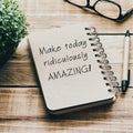 Inspirational quotes on a notepad - Make today ridiculously amazing. Blurry retro style background