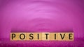 inspirational and motivational word of positive on wooden blocks in vintage background