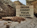 Inspirational and motivational words of decide commit focus succeed on wooden blocks Royalty Free Stock Photo