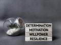 Inspirational and motivational words of determination motivation willpower resilience wooden blocks. Stock photo.