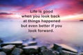 New year quote with phrase - life is good when you look back at things happened but even better if you look forward