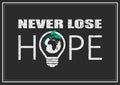 Inspirational positive vector typography slogan Never lose hope with light bulb, Earth and grunge texture isolated on black Royalty Free Stock Photo