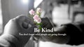 Inspirational quote - Be kind. You don\'t know what people are going through. With helping hands holding rose flower.pink