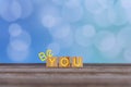 Inspirational quote - Be you. The real you with creative words design on wooden cubes on soft vintage blue bokeh background.