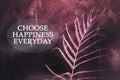 Inspirational quote - Choose happiness everyday. Fern leaf on digital texture effect background in abstract light-dark purple.