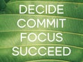 Inspirational quote - decide commit focus succeed text on green background. Royalty Free Stock Photo