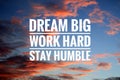 Inspirational quote - Dream big. Work hard. Stay humble. Sign and text message on dramatic colorful sky background. Royalty Free Stock Photo