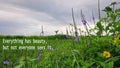 Inspirational quote - Everything has beauty, but not everyone sees it. With nature green grass and flowers background under blue