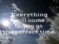 Inspirational quote - Everything will come to you word at the perfect time. Text message on sky with sun light background