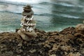 Inspirational quote - Find balance in life on background of rock balancing and calm wave water in the beach. Life balance.