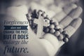 Inspirational quote - Forgiveness does not change the past but it does enlarge the future. With wooden Rosary and Jesus Christ