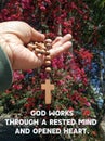 Inspirational quote - God works through a rested mind and opened heart. With senior woman holding rosary in hand with Jesus Christ Royalty Free Stock Photo