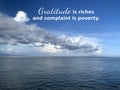 Inspirational quote - Gratitude is riches and complaint is poverty. On nature landscape background of bright blue sky with clouds Royalty Free Stock Photo