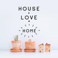 Inspirational quote `House,Love,Home`. Cactus plant on white background. Royalty Free Stock Photo