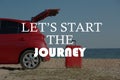 Inspirational quote - LetÃ¢â¬â¢s start the journey. Car and bright suitcase on sand near sea Royalty Free Stock Photo