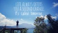 Inspirational quote - Life always offers you a second chance. It is called tomorrow. Young man silhouette standing, blue sky.