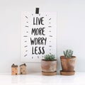 Inspirational quote `live more, worry less`.