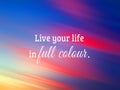 Inspirational quote - Live your life in full colour. On  blurry colorful sunset sunrise sky clouds background in pink blue red Royalty Free Stock Photo