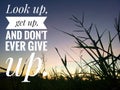 Inspirational quote - look up, get up, and do not ever give up. On background of beautiful sunset sunrise sky color over the field Royalty Free Stock Photo