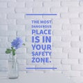 Inspirational quote `The most dangerous place is in your safety zone` Royalty Free Stock Photo