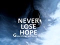 Inspirational quote - Never lose hope. Good things will come soon. With bulb lamp on blue and dark sky background. Hope concept.