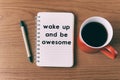 Inspirational quote on notepad - wake up and be awesome Royalty Free Stock Photo