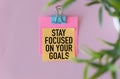 Inspirational quote - Stay focused on your goals. With text message on white paper. Royalty Free Stock Photo