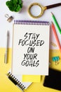 Inspirational quote - Stay focused on your goals. With text message on white paper book Royalty Free Stock Photo