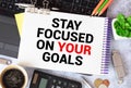 Inspirational quote - Stay focused on your goals. With text message on white paper book Royalty Free Stock Photo