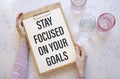 Inspirational quote - Stay focused on your goals. With text message on white paper Royalty Free Stock Photo