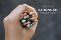 Inspirational quote - We are strong together. With Bunch of colored pencils in hand. Royalty Free Stock Photo