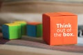 Inspirational quote written on the box - Think out of the box. Positive thinking concept. Royalty Free Stock Photo