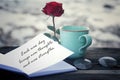 Inspirational words - Each new day brings new thoughts, new strengths. With red rose, coffee cup, glasses on the table. Royalty Free Stock Photo