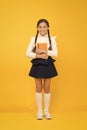 Inspirational quotes motivate kids for academic year ahead. School girl formal uniform hold book. School lesson. Study