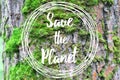 Inspirational text Save the planet on the tree bark background Royalty Free Stock Photo