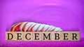 inspirational time concept - word december on wooden blocks with seashells in purple vintage background