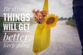 Inspirational words - Be strong. Things will get better. Keep going. Young man or woman with bouquet of flowers in yellow eco bag. Royalty Free Stock Photo