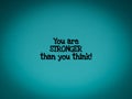 Inspirational words of you are stronger than you think in vintage background